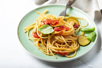 Traditional itaian spaghetti with tomato and zucchini