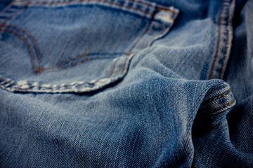 brown seam denim  and old blue jeans denim texture close up
