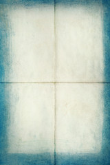Blank old letter folded in four with blue edges, texture background