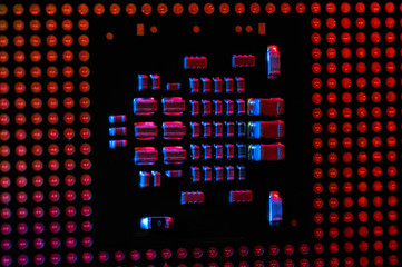PC Processor close up in blue and red rays. Technology background.
