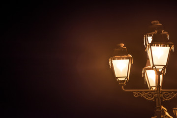 Fototapeta na wymiar Frozen street lamp in a winter night
