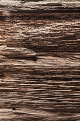Fototapeta premium Vintage brown messy wooden texture vertical view