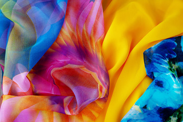 Colorful silk fabric for summer clothes. Sew clothes made of lightweight silk fabric. View from...