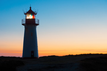 Fototapeta na wymiar Silhouette of Lighthouse List-West after sunset.