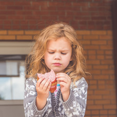 at recess at school girl, child out, at lunch with a book