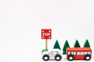 Road traffic with wooden toy cars in the town on white background, safety and traffic regulations concept, backgrounds.Transportation system concept.