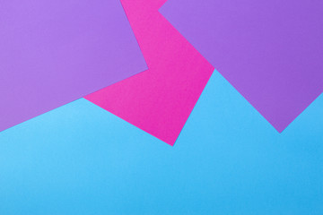 Color papers geometry flat composition background with pink violet and blue tones