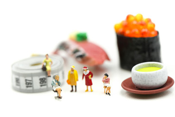Miniature people : beautiful woman and doctor  with tape Measure of food diet,Healthcare and diet concept.