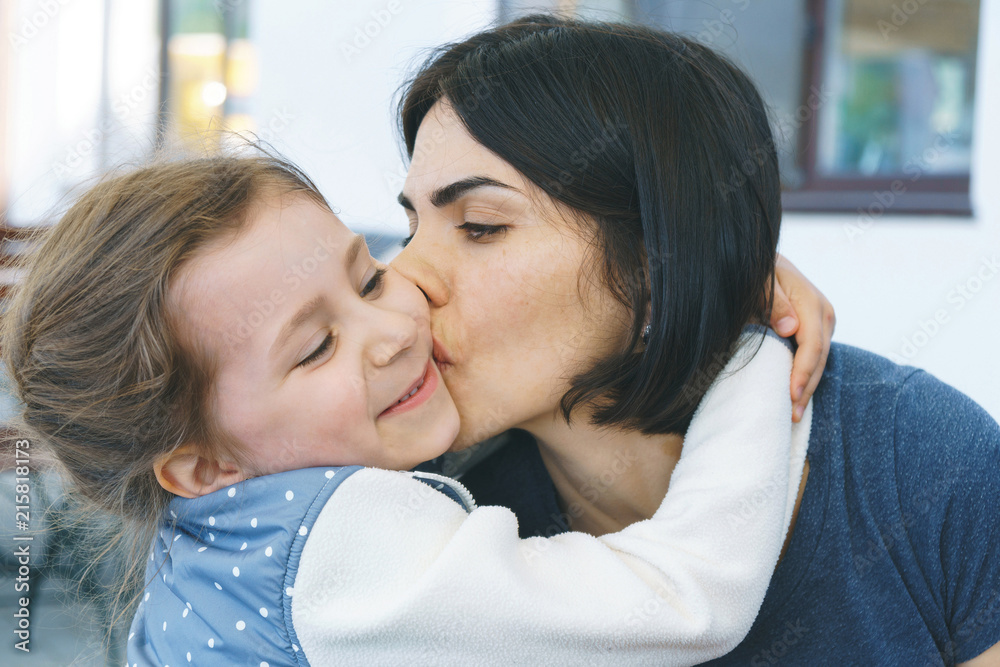 Poster Mother Kissing Daughter in Cheek