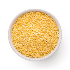 Fresh organic millet in bowl, Top view.