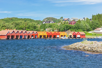 Typical Norwegian boat houses at the waterfront in Svennevik