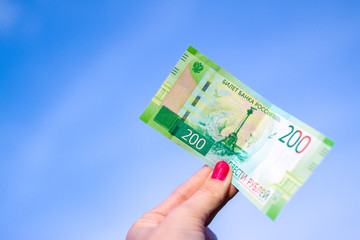 Banknote Two hundred russian rubles on blue sky background