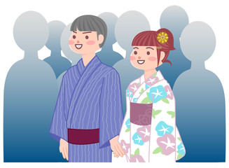 Obraz premium 人ごみを歩く浴衣のカップル