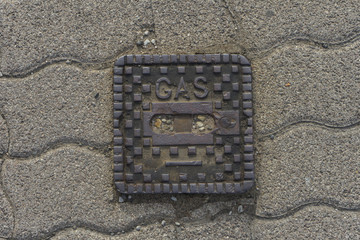 surface box on street made of metal saying 