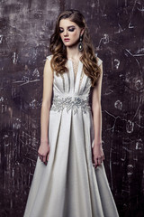Young model posing in luxury wedding dress