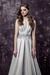 Obraz premium Young model posing in luxury wedding dress