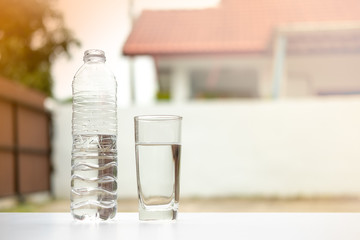 drinking water in glass and bottle