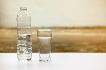 drinking water in glass and bottle