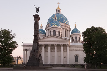 Fototapeta na wymiar Trinity Izmailovo Cathedral And the column of Glory. The view from the side of the Izmajlovsky prospectus. Russia, St. Petersburg. July 2018.