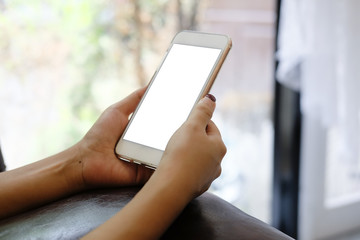 Side view woman hands using smartphone mock up.