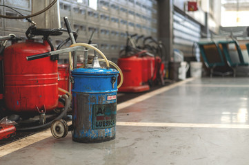 lubricating oils tank in the garage with soft-focus and over light in the background