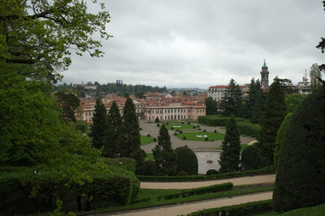 Fototapeta na wymiar Estense Palace, or Palazzo Estense, the residence of Franchesco III d'Este, Duke of Modena and Reggio, and beautiful green park in front of it, Italy