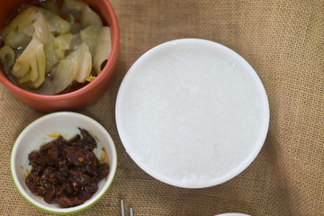 Mush or Boiled rice with pickled vegetables.