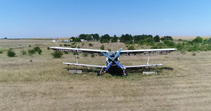 4K aerial video of an old broken abandoned airplane. Flying over
