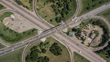 Top down aerial view of transportation highway overpass, ringway, roundabout