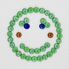 Green happy smilie from smalt in 3D