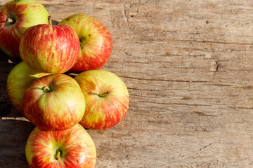 Fresh ripe apples on wooden table. Top view, copy space