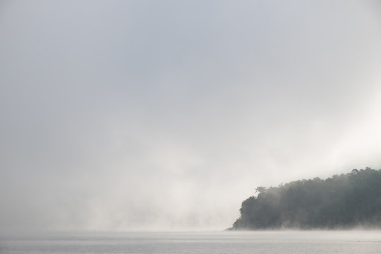 The mist in the lake in the morning. © Wuttisit
