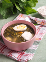 Soup with sorrel and egg. Light summer green soup.