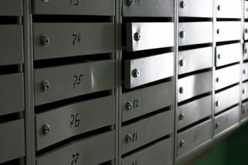 gray metal mailboxes in the entrance of a apartment building