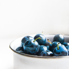 background texture plum blue color on white in a circle fruit sweet matte beautiful juicy copy space