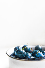 background texture plum blue color on white in a circle fruit sweet matte beautiful juicy copy space