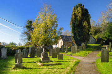 Tombstones in an old cemetery on the church yard in West Sussex, England