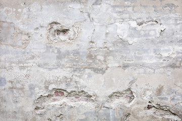 Damaged grey concrete wall exterior background texture - 215834339