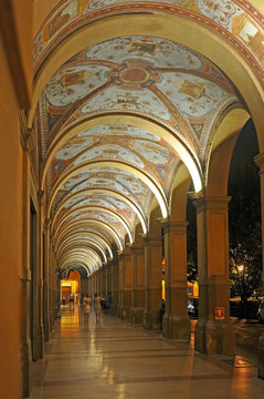 Italy, Bologna night view of an old medieval typical portico in Farini square.