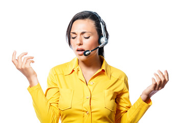 Argumentative call centre operator taking a call speaking into the microphone with a frown and...
