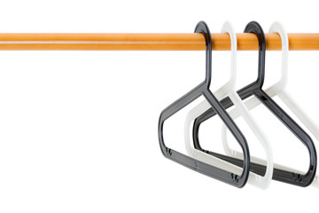 Four of black and white clothes hanger on a wooden clothes rack with copy space. Fashion and Housework Concept. Realistic and isolated on white background.