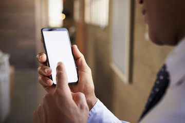 Close up of mixed race man using smartphone