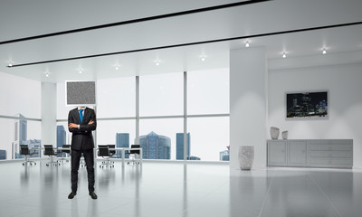 Businessman with monitor instead of head.