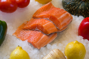 Fresh salmon fillet on ice.