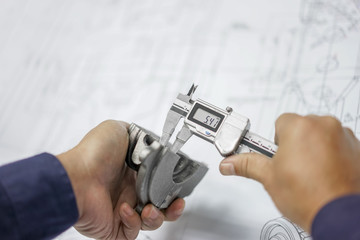 Engineering inspection check dimension automotive parts reference drawing by vernier caliper in factory