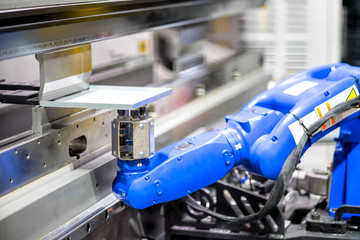 Hand robot working automatic cutting and bending metal sheet by high precision metal sheet bending...