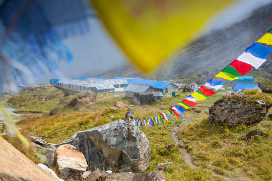 Prayer flags above a trail leading to the tea house at Annapurna Base camp, Nepal.