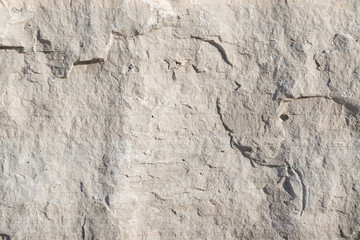 Background geology closeup limestone rock face showing weathered strata wallpaper - obrazy, fototapety, plakaty