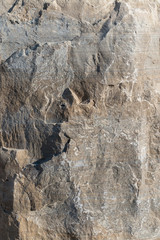 Obraz premium Background geology closeup limestone rock face showing weathered strata wallpaper