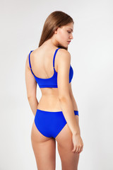 Fototapeta premium Beautiful woman in blue bikini